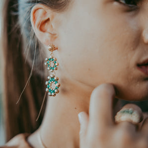 Gold set with green pearl flowers