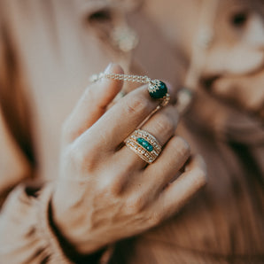 Gold set with green pearl flowers